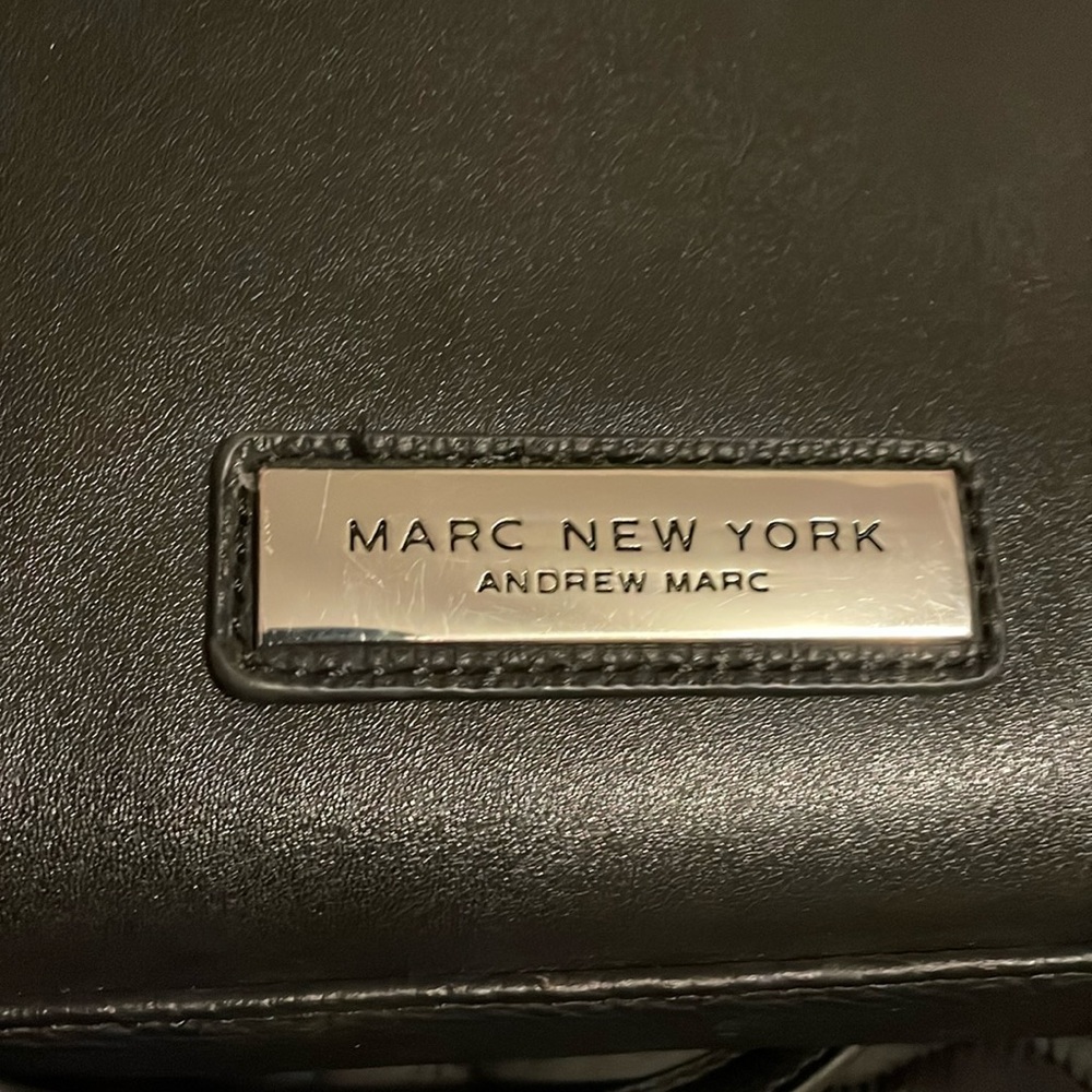 Black leather over the shoulder purse. Back pocket.